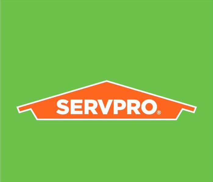Green background and orange SERVPRO sign
